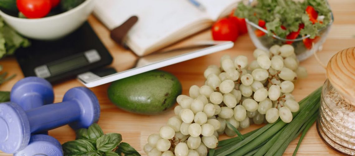 A vibrant composition of fruits, vegetables, and fitness items promoting a healthy lifestyle.